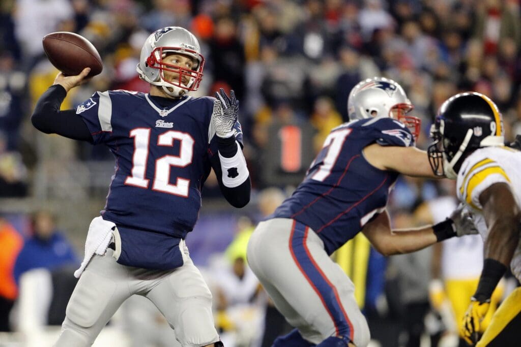 Nov 3, 2013; Foxborough, MA, USA; New England Patriots quarterback Tom Brady (12) throws a pass against the Pittsburgh Steelers in the second half at Gillette Stadium. The Patriots defeated the Steelers 55-31.