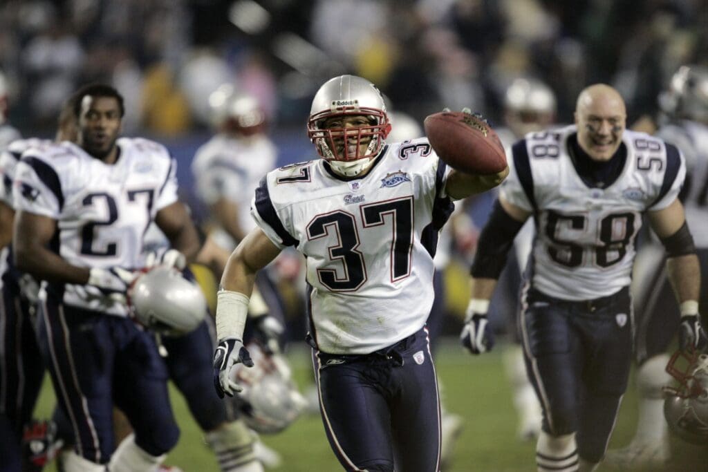 Feb 06, 2005; Jacksonville, FL, USA; New England Patriots safety Rodney Harrison (37) celebrates his late-game interception that sealed the Patriots 24-21 win over the Philadelphia Eagles in Super Bowl XXXIX at Alltel Stadium.