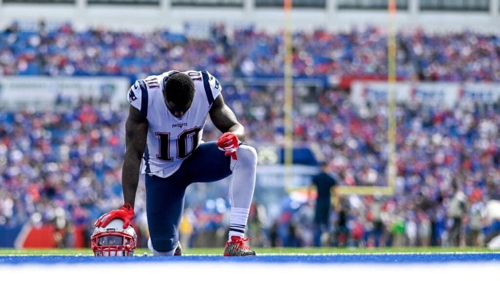 Sep 29, 2019; Orchard Park, NY, USA; New England Patriots wide receiver Josh Gordon (10) takes a knee in the end zone prior to the game between the Buffalo Bills and the New England Patriots at New Era Field.