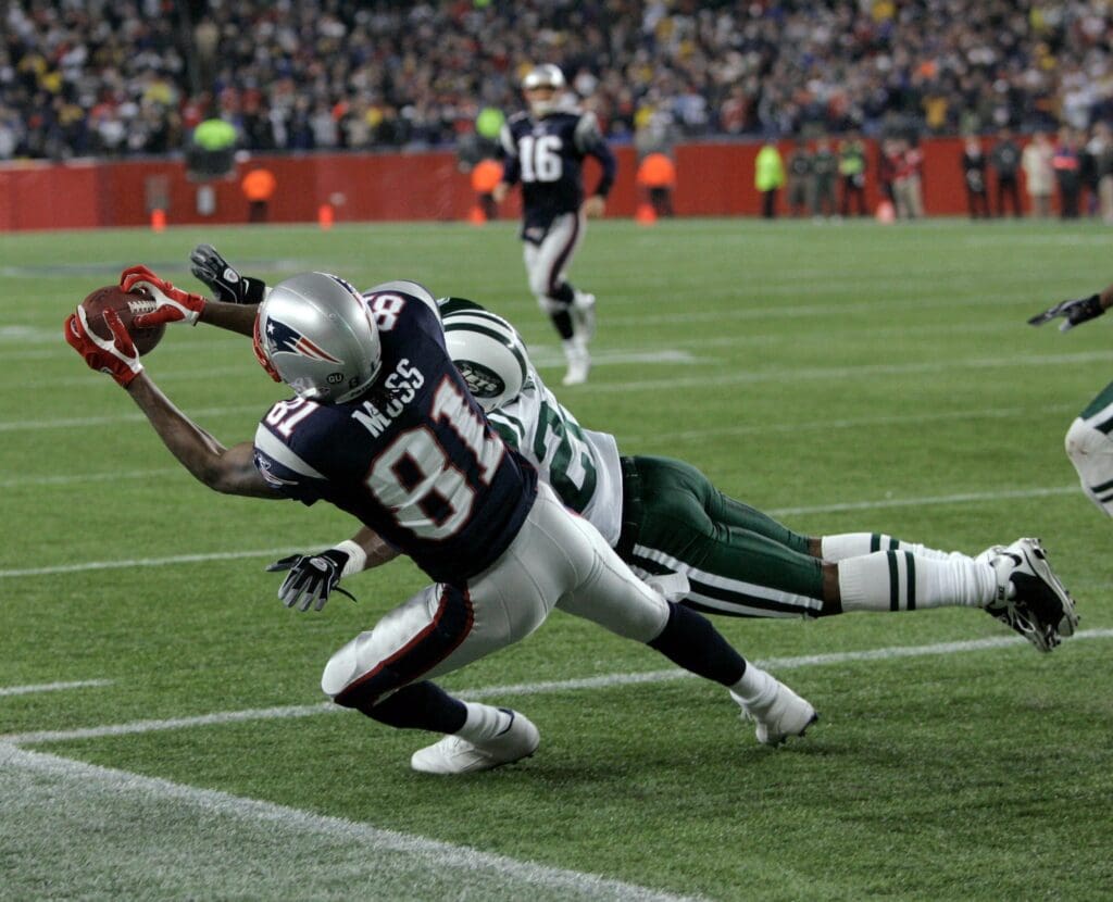 Nov 13, 2008; Foxboro, MA, USA; New England Patriots wide receiver Randy Moss (81) makes a touchdown catch in the fourth inning over New York Jets defensive back Ty Law (22) at Gillette Stadium. The Jets defeated the Patriots 34-31.