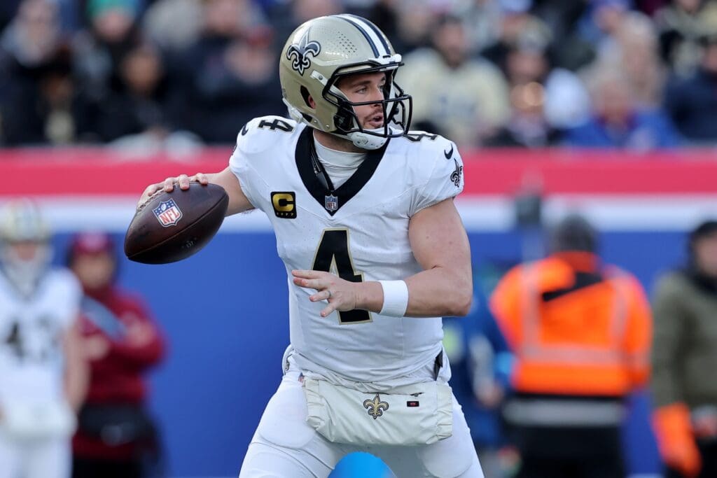 Dec 8, 2024; East Rutherford, New Jersey, USA; New Orleans Saints quarterback Derek Carr (4) drops back to pass against the New York Giants during the first quarter at MetLife Stadium