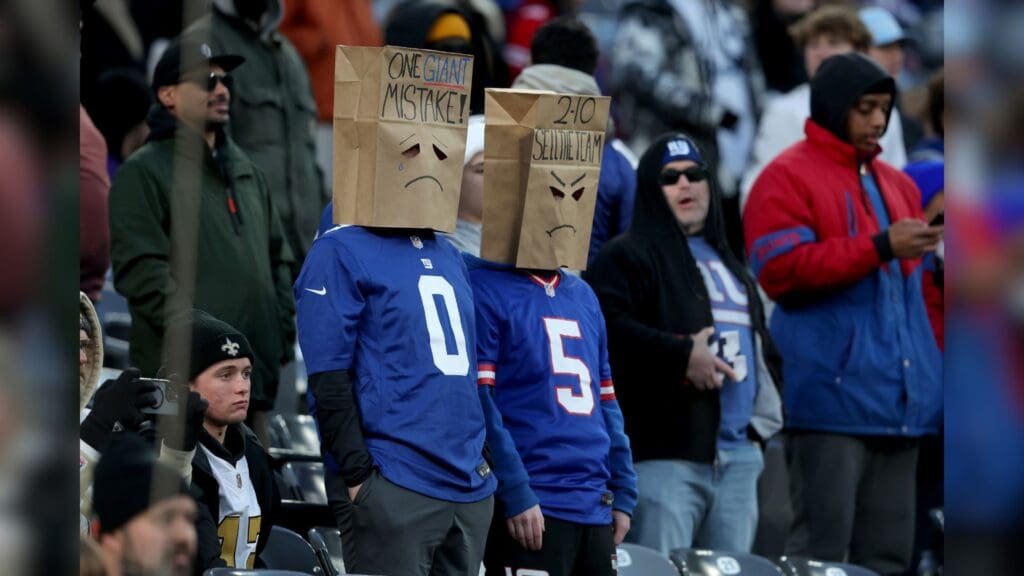 Dec 8, 2024; East Rutherford, New Jersey, USA; New York Giants fans wear paper bags on their heads during the fourth quarter against the New Orleans Saints at MetLife Stadium.