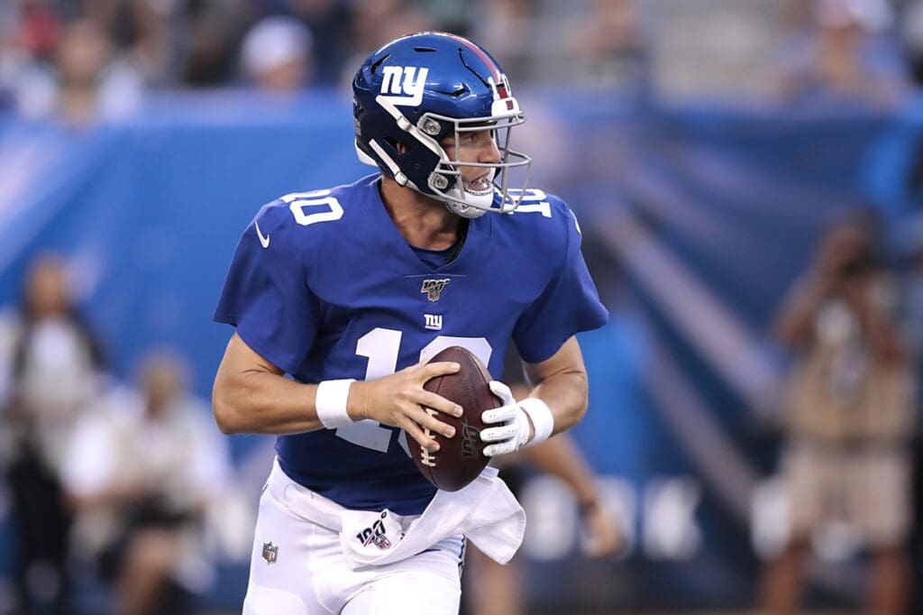 Aug 8, 2019; East Rutherford, NJ, USA; New York Giants quarterback Eli Manning (10) rolls out during the first half against the New York Jets at MetLife Stadium.