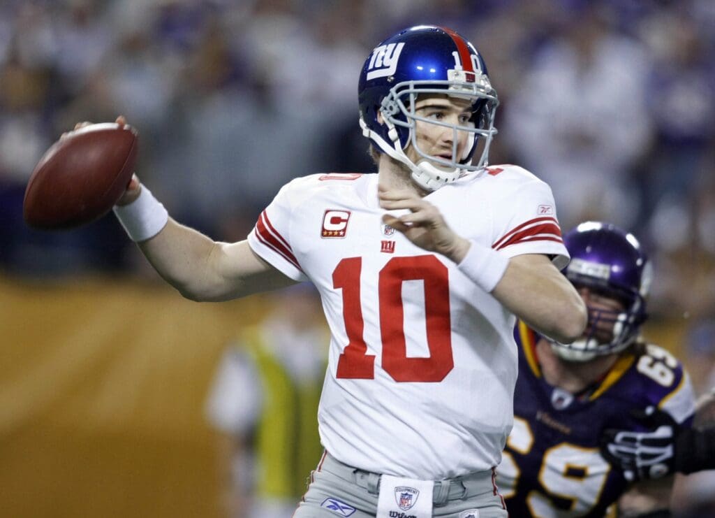 Jan 3, 2010; Minneapolis, MN, USA; New York Giants quarterback Eli Manning (10) looks to pass against the Minnesota Vikings in the second quarter at the Metrodome.