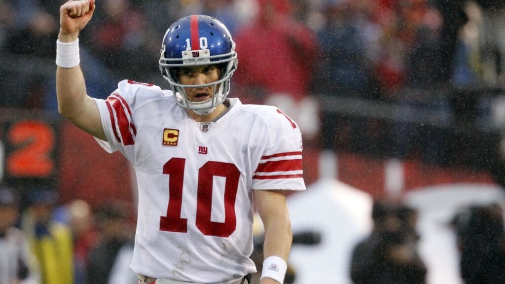 Jan 22, 2012; San Francisco, CA, USA; New York Giants quarterback Eli Manning (10) reacts after throwing a touchdown pass during the first half of the 2011 NFC Championship game against the San Francisco 49ers at Candlestick Park.