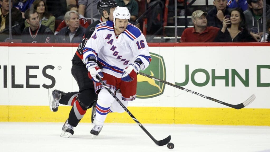January 20, 2011; Raleigh, NC, USA; New York Rangers left wing Sean Avery (16) carries the puck against the Carolina Hurricanes at the RBC center.The Hurricanes defeated the Rangers 4-1.