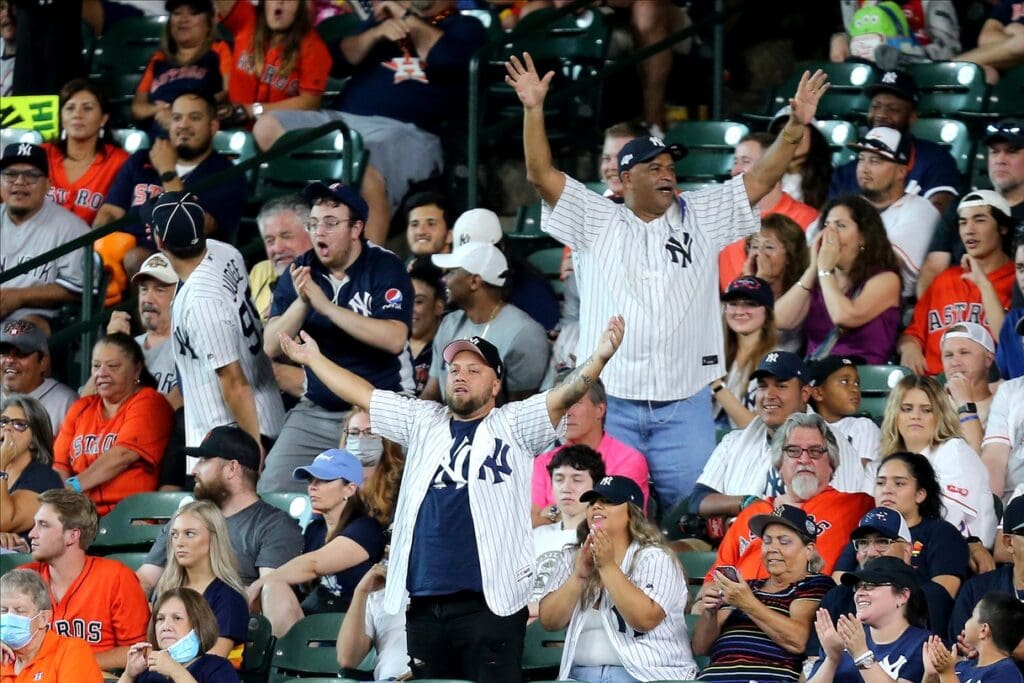 Jul 11, 2021; Houston, Texas, USA; New York Yankees fans in the outfield cheer on the action during the eighth inning against the Houston Astros at Minute Maid Park.