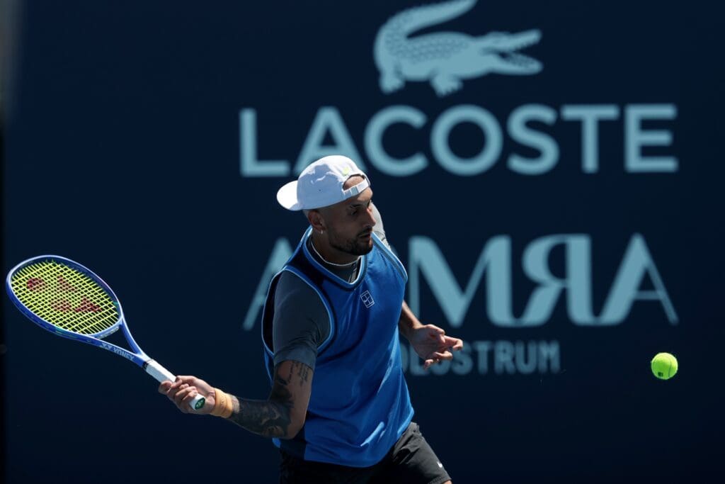 Mar 21, 2025; Miami, FL, USA; Nick Kyrgios (AUS) hits a ball out of the stadium in frustration after losing a point against Karen Khachanov (not pictured) on day four of the Miami Open at Hard Rock Stadium.