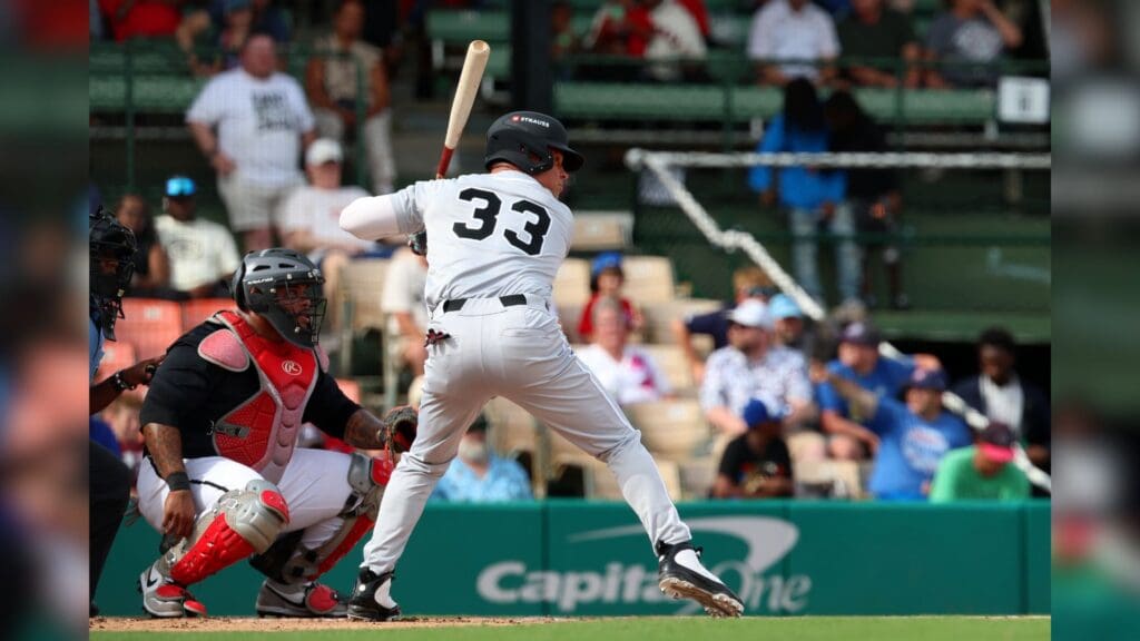 Jun 19, 2025; Birmingham, AL, USA; West team outfielder Nick Swisher (33) swings at the ball during the East-West Classic at Rickwood Field.