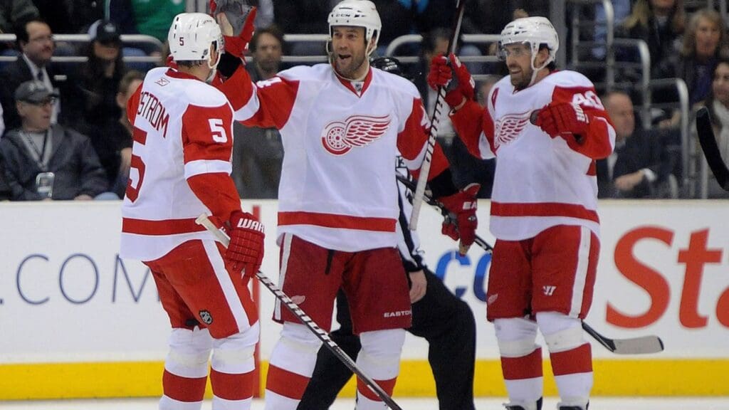 Feb 28, 2011; Los Angeles, CA, USA; Detroit Red Wings defenseman Niklas Lidstrom (5), right wing Todd Bertuzzi (44) and left wing Henrik Zetterberg (40) react after a goal in the second period against the Los Angeles Kings at the Staples Center. The Red Wings defeated the Kings 7-4.