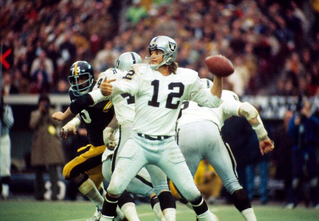 Dec 23, 1972; Pittsburgh, PA, USA; FILE PHOTO; Oakland Raiders quarterback (12) Ken Stabler drops back to pass against the Pittsburgh Steelers during the 1972 AFC Divisional Playoff game at Three Rivers Stadium. The Steelers defeated the Raiders 13-7. 