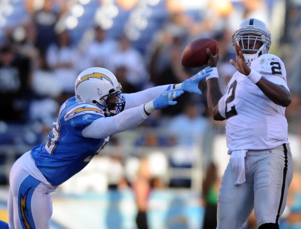 Nov 1, 2009; San Diego, CA, USA; Oakland Raiders quarterback JaMarcus Russell (2) is hit by San Diego Chargers inside linebacker Stephen Cooper (54)for a sack late in the the fourth quarter against the San Diego Chargers at Qualcomm Stadium. The Raiders lost 24-16. 