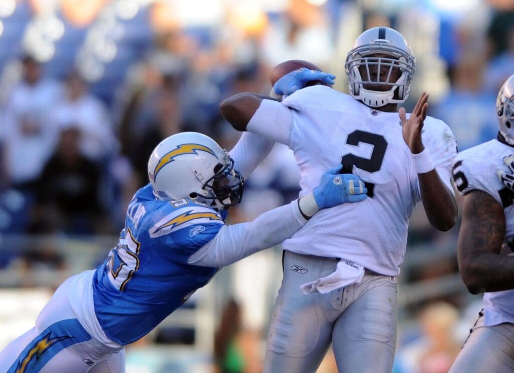 Nov 1, 2009; San Diego, CA, USA; Oakland Raiders quarterback JaMarcus Russell (2) is hit by San Diego Chargers inside linebacker Stephen Cooper (54)for a sack late in the the fourth quarter against the San Diego Chargers at Qualcomm Stadium. The Raiders lost 24-16.