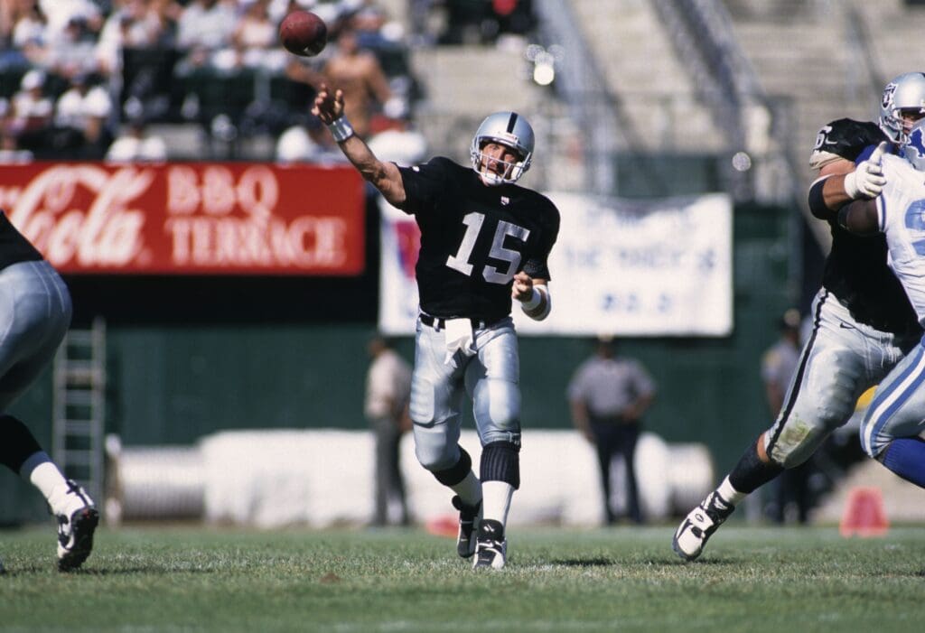 Oct 13, 1996; Oakland, CA, USA; FILE PHOTO; Oakland Raiders quarterback Jeff Hostetler (15) throws the ball against the Detroit Lions at Oakland-Alameda County Coliseum.