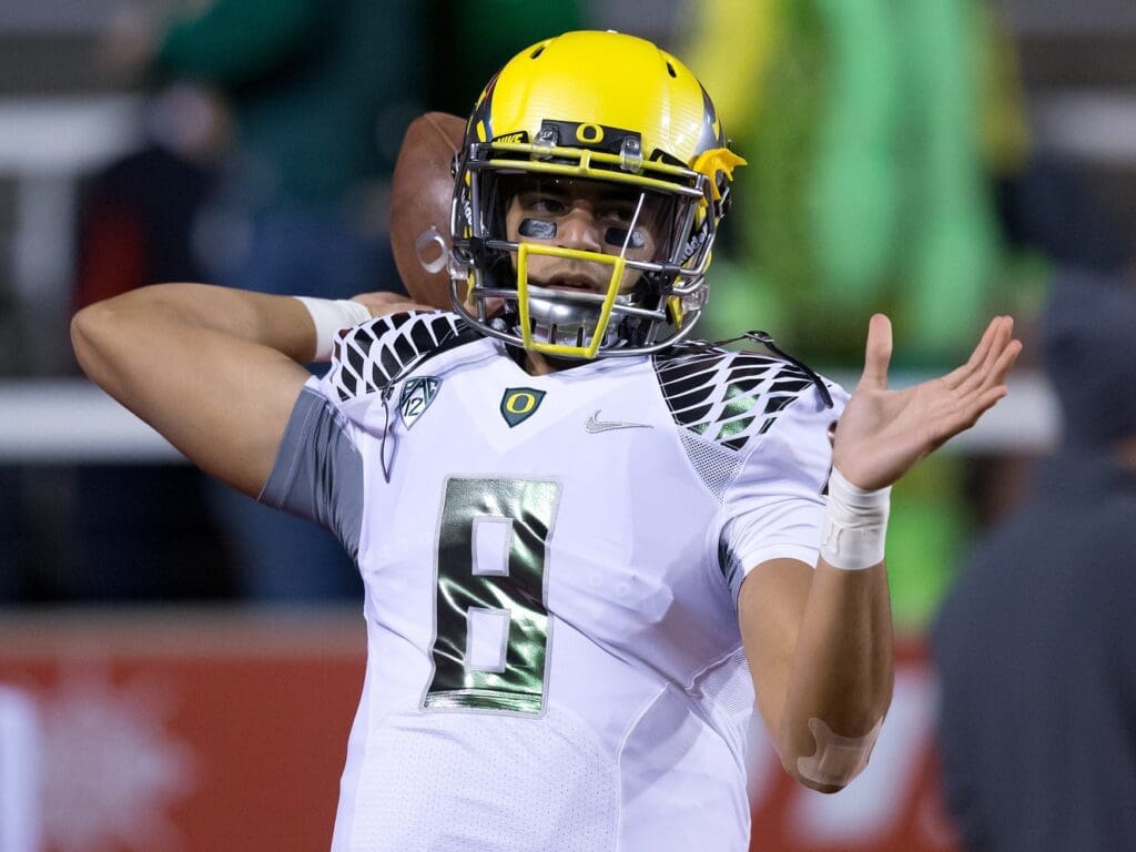 Nov 8, 2014; Salt Lake City, UT, USA; Oregon Ducks quarterback Marcus Mariota (8) warms up prior to the game against the Utah Utes at Rice-Eccles Stadium. Oregon won 51-27.