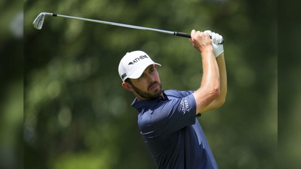 Jun 27, 2025; Detroit, Michigan, USA; Patrick Cantlay plays his shot from the ninth tee during the second round of the Rocket Mortgage Classic golf tournament.
