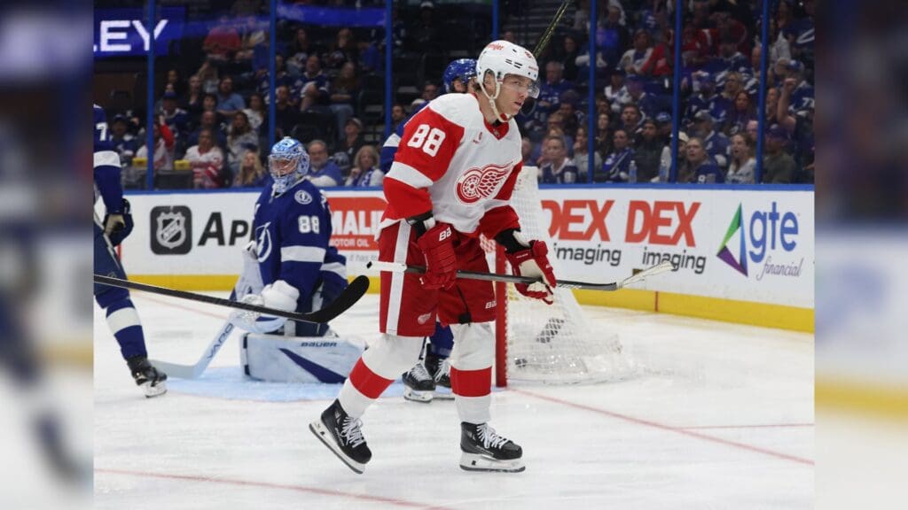 Apr 11, 2025; Tampa, Florida, USA; Detroit Red Wings right wing Patrick Kane (88) reacts after he scored a goal as Tampa Bay Lightning goaltender Andrei Vasilevskiy (88) looks on during the second period at Amalie Arena.
