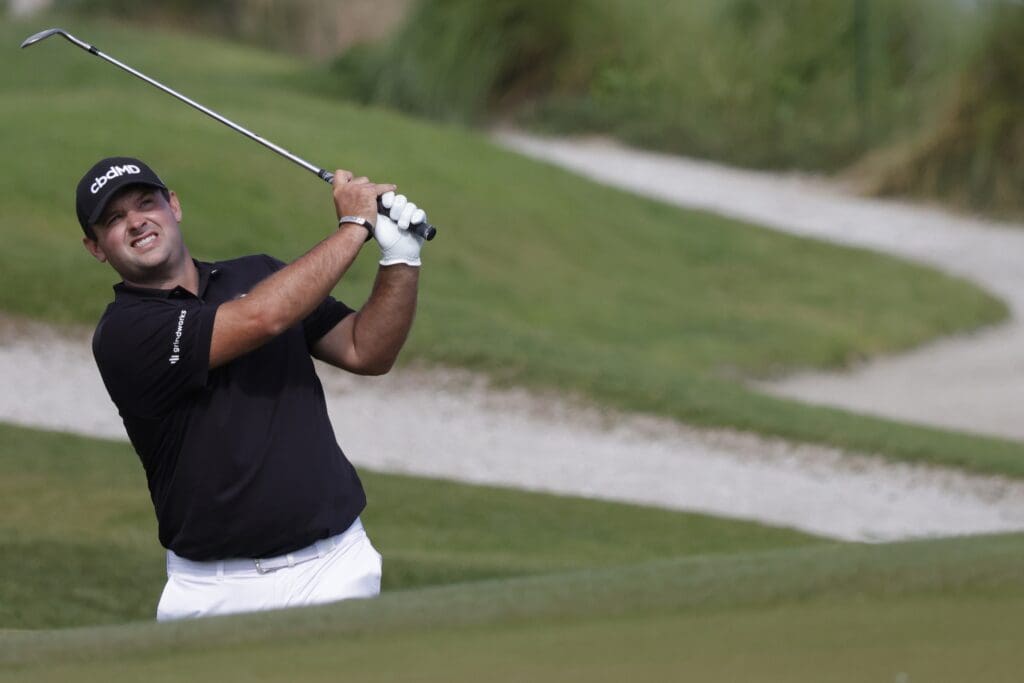 May 18, 2021; Kiawah Island, South Carolina, USA; Patrick Reed plays out of a bunker on the ninth hole during a practice round for the PGA Championship golf tournament at Ocean Course at Kiawah Island Resort.