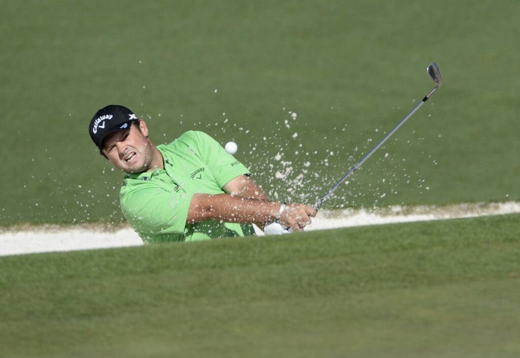 Apr 7, 2016; Augusta, GA, USA; Patrick Reed hits out of a bunker on the 2nd hole during the first round of the 2016 The Masters golf tournament at Augusta National Golf Club.