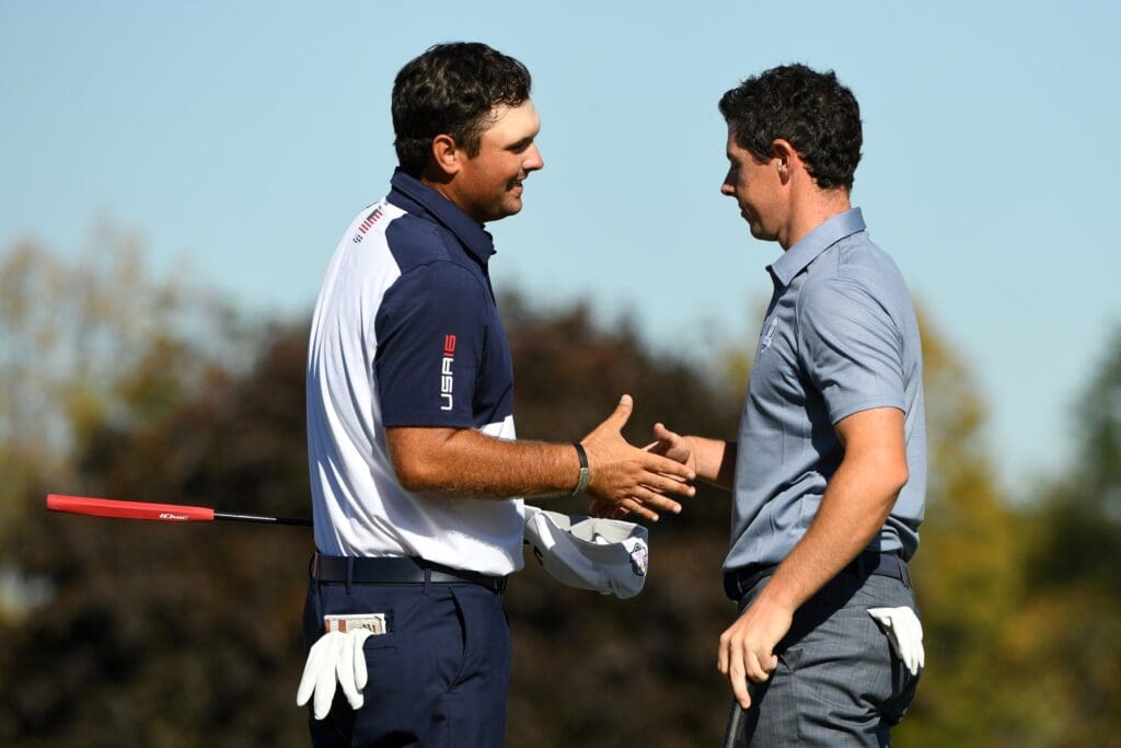 Oct 2, 2016; Chaska, MN, USA; Patrick Reed of the United States and Rory McIlroy of Northern Ireland shake hands after their match during the single matches in 41st Ryder Cup Hazeltine National Golf Club.