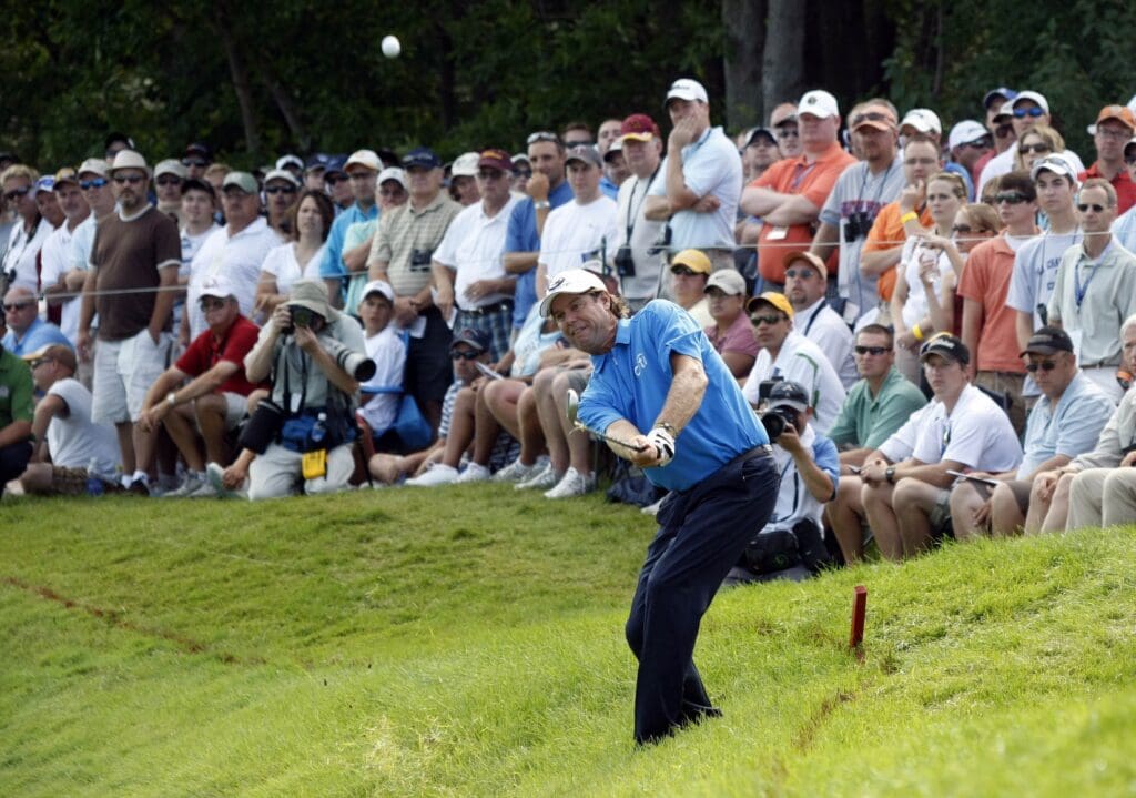 Aug 14, 2009; Chaska, MN, USA; Paul Azinger (USA) hits out of the rough on the 15th hole during the second round of the 2009 PGA Championship at Hazeltine National Golf Club.