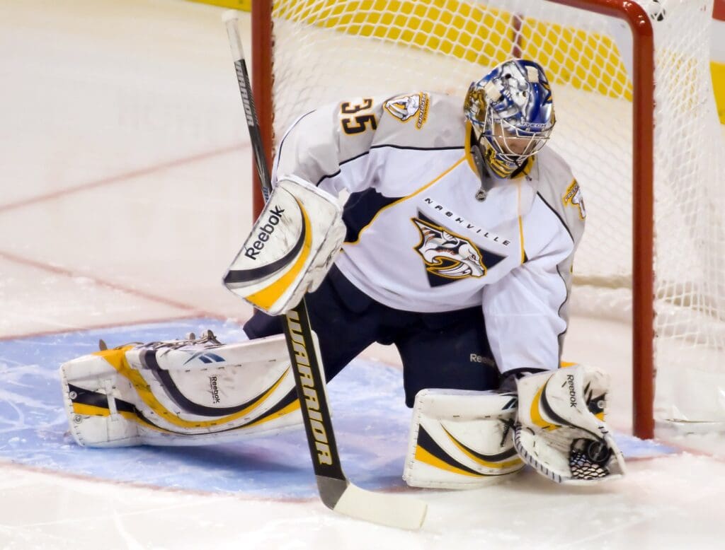 December 8, 2008; St. Louis, MO, USA; Nashville Predators goalie Pekka Rinne (35) makes a glove save in the first period against the St. Louis Blues at the Scottrade Center.