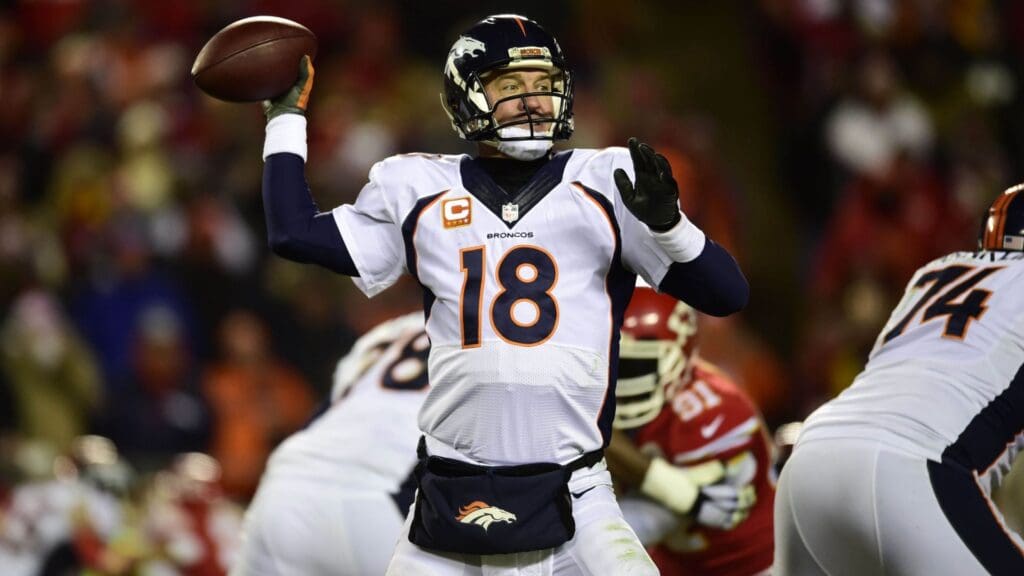 Nov 30, 2014; Kansas City, MO, USA; Denver Broncos quarterback Peyton Manning (18) prepares to pass in the second quarter against the Kansas City Chiefs at Arrowhead Stadium. The Broncos defeated the Chiefs 29-16.