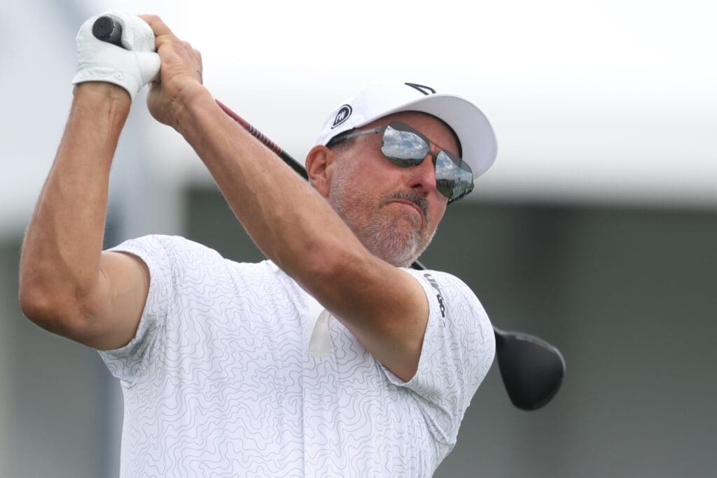 Jun 10, 2025; Oakmont, Pennsylvania, USA; Phil Mickelson hits from the tenth tee box during a practice round for the U.S. Open golf tournament at Oakmont Country Club.