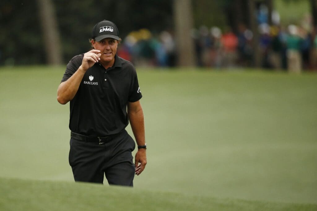 Apr 12, 2015; Augusta, GA, USA; Phil Mickelson walks up to the 18th green during the final round of The Masters golf tournament at Augusta National Golf Club.