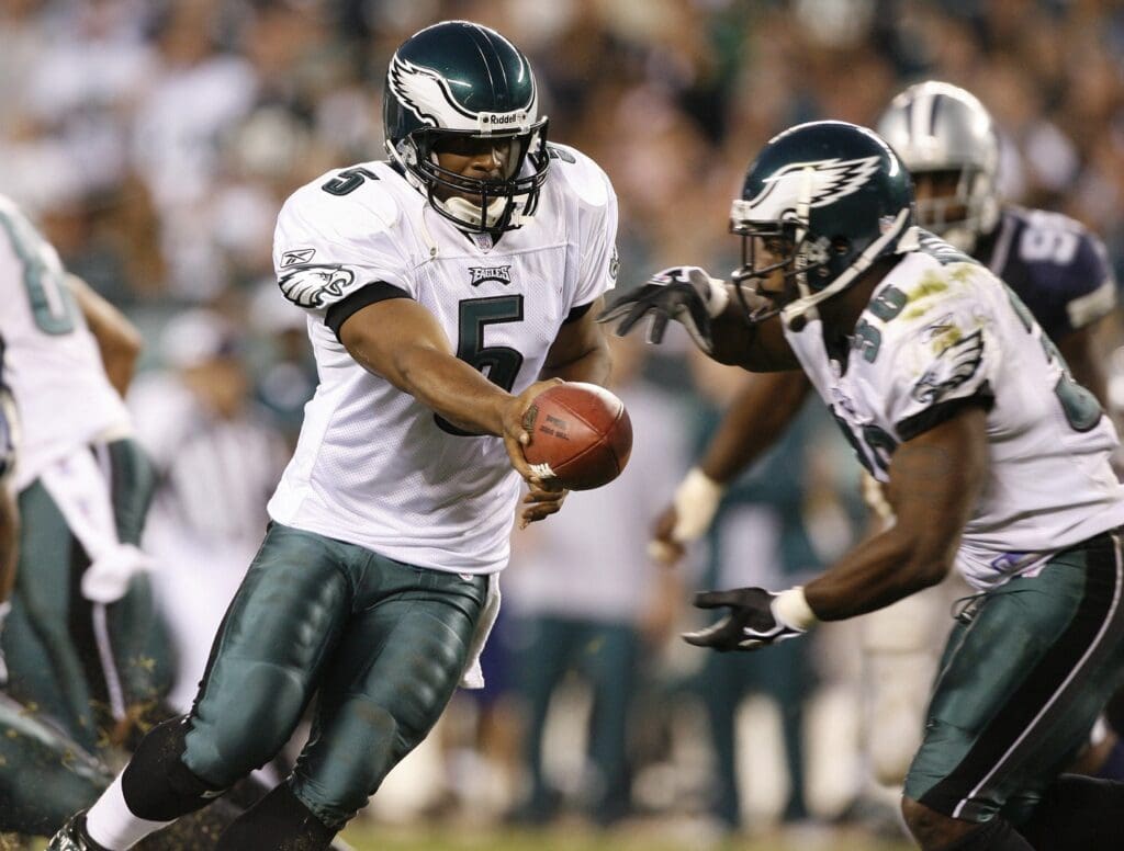Oct 8, 2006; Philadelphia, PA, USA; Philadelphia Eagles quarterback (5) Donovan McNabb hands off to running back (36) Brian Westbrook in the third quarter against the Dallas Cowboys at Lincoln Financial Field. The Eagles beat the Cowboys 38-24. M