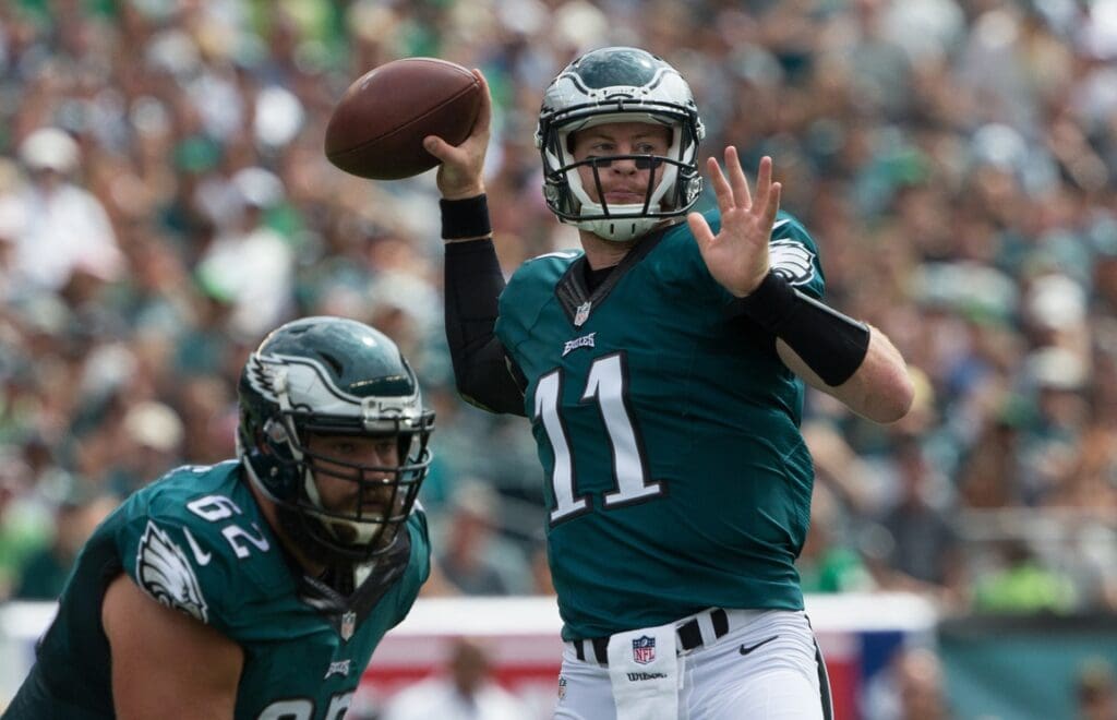 Sep 11, 2016; Philadelphia, PA, USA; Philadelphia Eagles quarterback Carson Wentz (11) throws his first touchdown pass of his career against the Cleveland Browns during the first quarter at Lincoln Financial Field.
