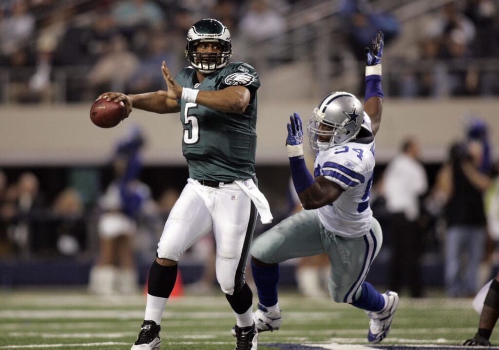 Jan 9, 2010; Arlington, TX, USA; Philadelphia Eagles quarterback Donovan McNabb (5) is chased by Dallas Cowboys linebacker DeMarcus Ware (94) during the second half of the 2010 NFC wild card playoff game at Cowboys Stadium. The Cowboys defeated the Eagles 34-14.