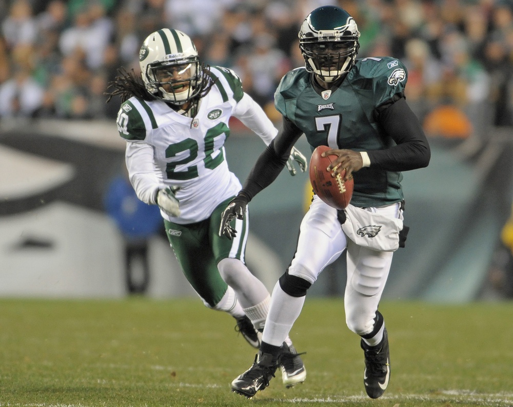 December 18, 2011; Philadelphia, PA USA; Philadelphia Eagles quarterback Michael Vick (7) scrambles away from New York Jets cornerback Kyle Wilson (20) in the 1st quarter of game at Lincoln Financial Field.