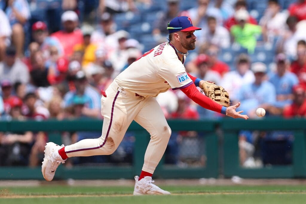 Jul 2, 2025; Philadelphia, Pennsylvania, USA; Philadelphia Phillies first base Bryce Harper (3) fields a ball for an out against the San Diego Padres during the fifth inning at Citizens Bank Park.