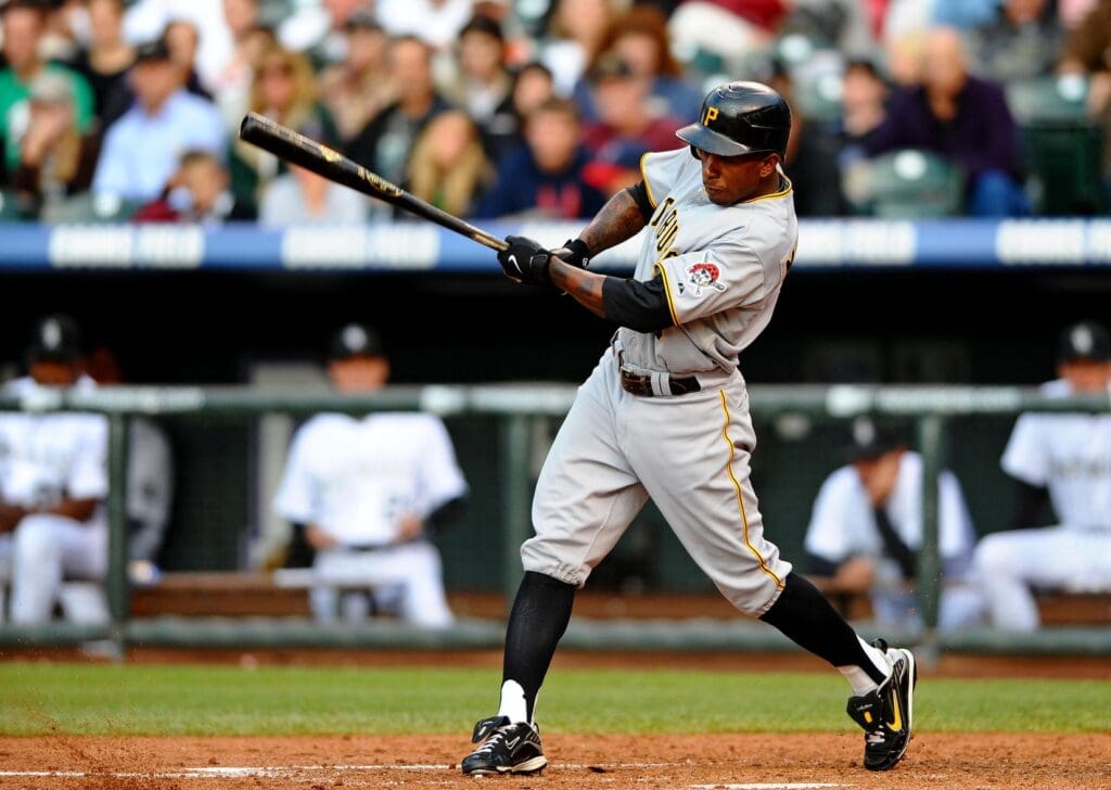 June 20, 2009; Denver, CO, USA; Pittsburgh Pirates left fielder Nyjer Morgan (3) hits a single to center field in the third inning against the Colorado Rockies at Coors Field.