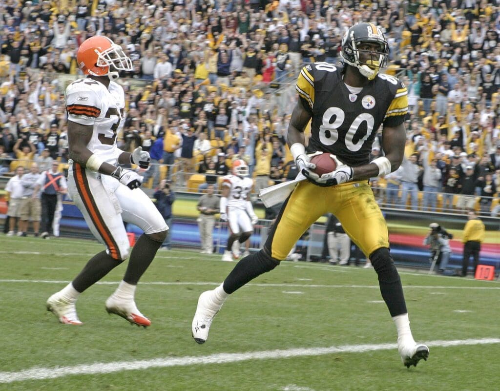 Oct 10, 2004; Pittsburgh, Pennsylvania, USA;Pittsburgh Steelers #80 Plaxico Burress walks into the endzone in the second quarter behind Cleveland Browns #37 Anthony Henry at Heinz Field. Steelers beat the Browns 34-23.
