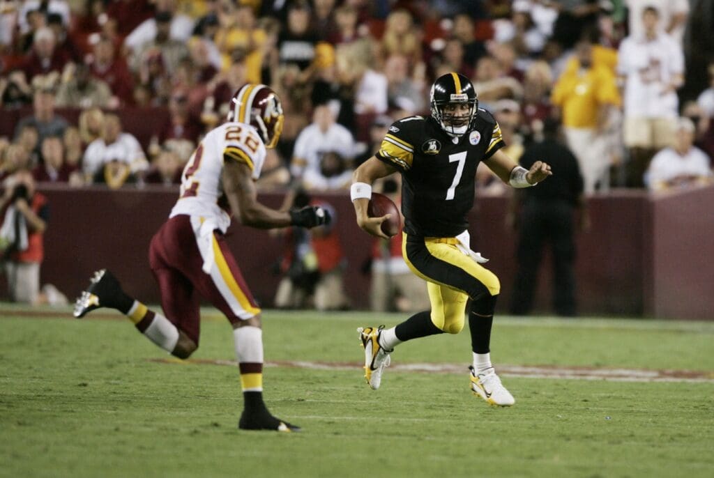 Aug 18, 2007; Landover, MD, USA; Pittsburgh Steelers quarterback Ben Roethlisberger (7) carries the ball as Washington Redskins cornerback Carlos Rogers (22) gives chase in the second quarter during a preseason game at FedEx Field in Landover, MD. 