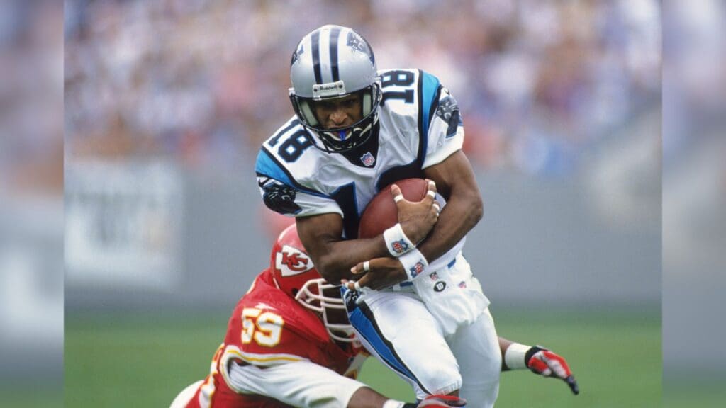 Sep 21, 1997; Charolette, NC, USA; FILE PHOTO; Carolina Panthers receiver Rae Carruth (83) carries the ball against Kansas City Chiefs linebacker Donnie Edwards (59) at Ericsson Stadium.