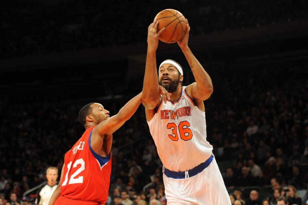Nov 4, 2012; New York, NY, USA; New York Knicks forward Rasheed Wallace (36) draws a foul against Philadelphia 76ers forward Evan Turner (12) during the second half at Madison Square Garden. The Knicks won the game 100-84.