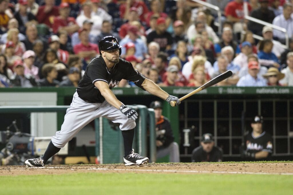 Sep 26, 2014; Washington, DC, USA; Miami Marlins left fielder Reed Johnson (5) hits a rbi double during the fifth inning against the Washington Nationals in game two of a baseball doubleheader at Nationals Park
