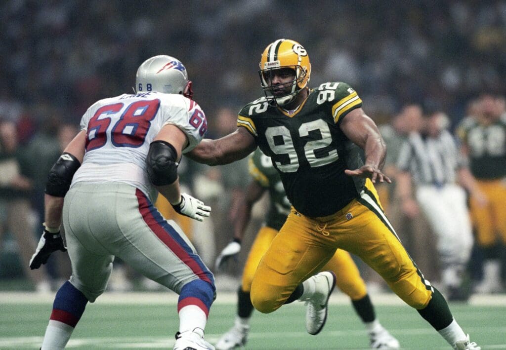 Jan 26, 1997; New Orleans, LA, USA; FILE PHOTO; Green Bay Packers defensive end Reggie White (92) battles New England Patriots tackle Max Lane (68) during Super Bowl XXXI at the Superdome. The Packers defeated the Patriots 35-21.