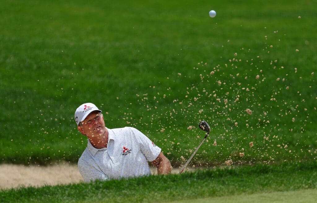 Retief Goosen of South Africa blasts out of the No. 7 bunker during the second round of the 2025 Kaulig Companies Championship at Firestone Country Club, Friday, June 20, 2025, in Akron, Ohio.