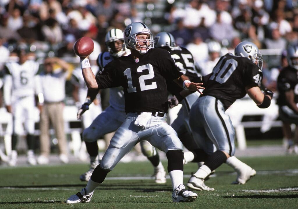 Oct 24, 1999; Oakland, CA, USA; FILE PHOTO; Oakland Raiders quarterback Rich Gannon (12) throws the ball against the New York Jets at Oakland-Alameda County Coliseum.