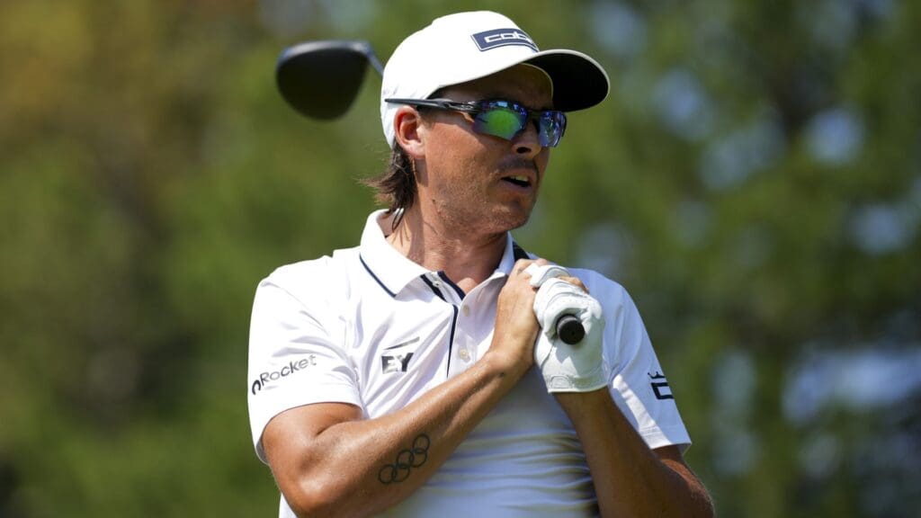 Jun 26, 2025; Detroit, Michigan, USA; Rickie Fowler reacts to his shot from the fourth tee during the first round of the Rocket Mortgage Classic golf tournament.