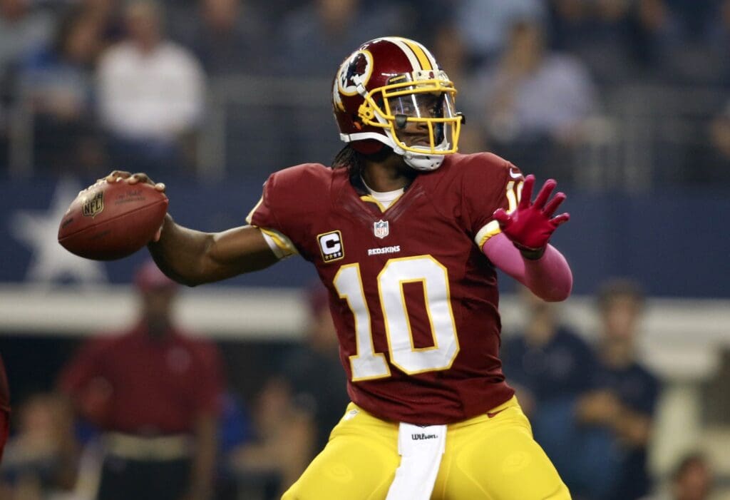 Oct 13, 2013; Arlington, TX, USA; Washington Redskins quarterback Robert Griffin III (10) throws a pass isn the first quarter against the Dallas Cowboys AT&T Stadium.