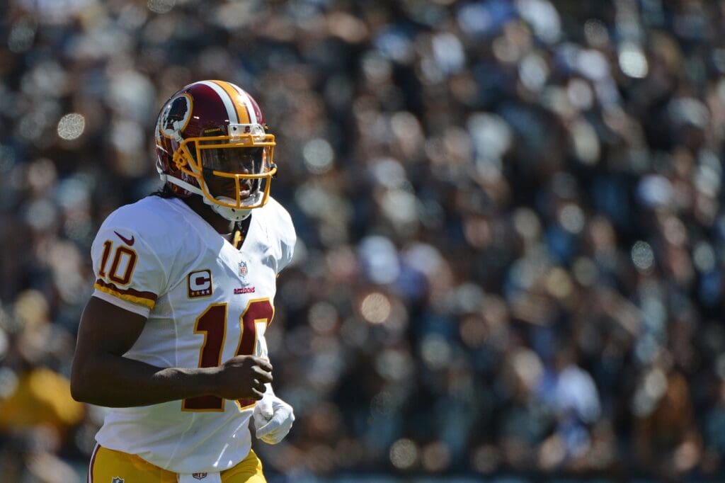 September 29, 2013; Oakland, CA, USA; Washington Redskins quarterback Robert Griffin III (10) jogs onto the field during the first quarter against the Oakland Raiders at O.co Coliseum. The Redskins defeated the Raiders 24-14.