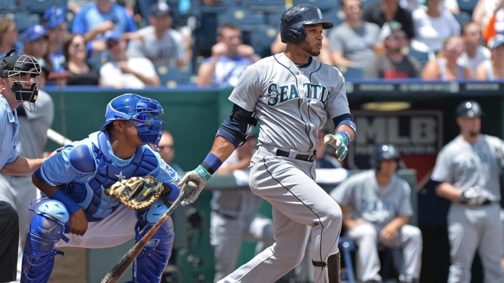 Jun 21, 2014; Kansas City, MO, USA; Seattle Mariners second basemen Robinson Cano (22) at bat against the Kansas City Royals during the first inning at Kauffman Stadium
