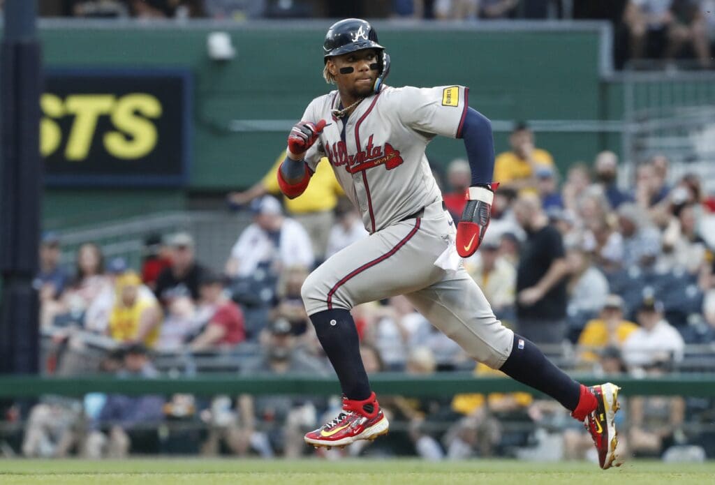 May 25, 2024; Pittsburgh, Pennsylvania, USA; Atlanta Braves right fielder Ronald Acuña Jr. (13) runs on his way to stealing second base against the Pittsburgh Pirates during the fifth inning at PNC Park.