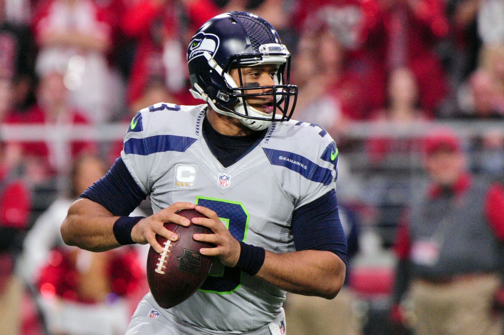 Jan 3, 2016; Glendale, AZ, USA; Seattle Seahawks quarterback Russell Wilson (3) drops back to pass during the first half against the Arizona Cardinals at University of Phoenix Stadium.