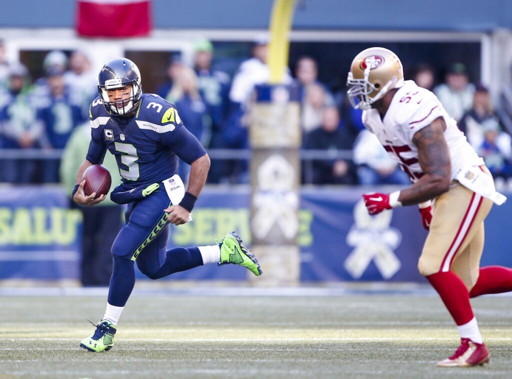 Nov 22, 2015; Seattle, WA, USA; Seattle Seahawks quarterback Russell Wilson (3) scrambles out of the pocket against the San Francisco 49ers during the first quarter at CenturyLink Field
